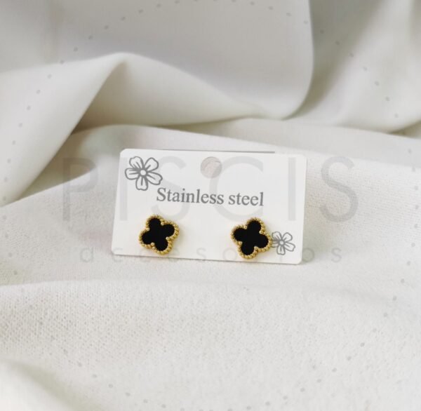Aros Van Cleef negros, dorados medianos.
