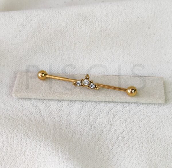 Piercing barra strass + bolitas, dorada.