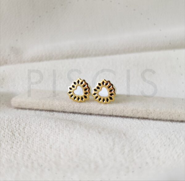 Aros Cori sparkles blancos con negro, dorados.