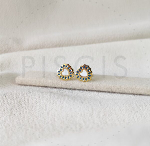 Aros Cori sparkles blancos con azul, dorados.