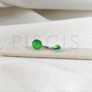 Piercing ombligo bolitas acrilicas verde con glitter.