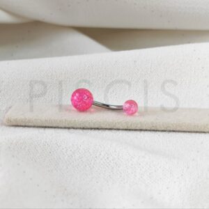 Piercing ombligo bolitas acrílicas rosa con glitter.