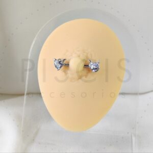 Piercing pezonera diablito blanco.
