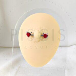 Piercing pezonera diablito rojo.