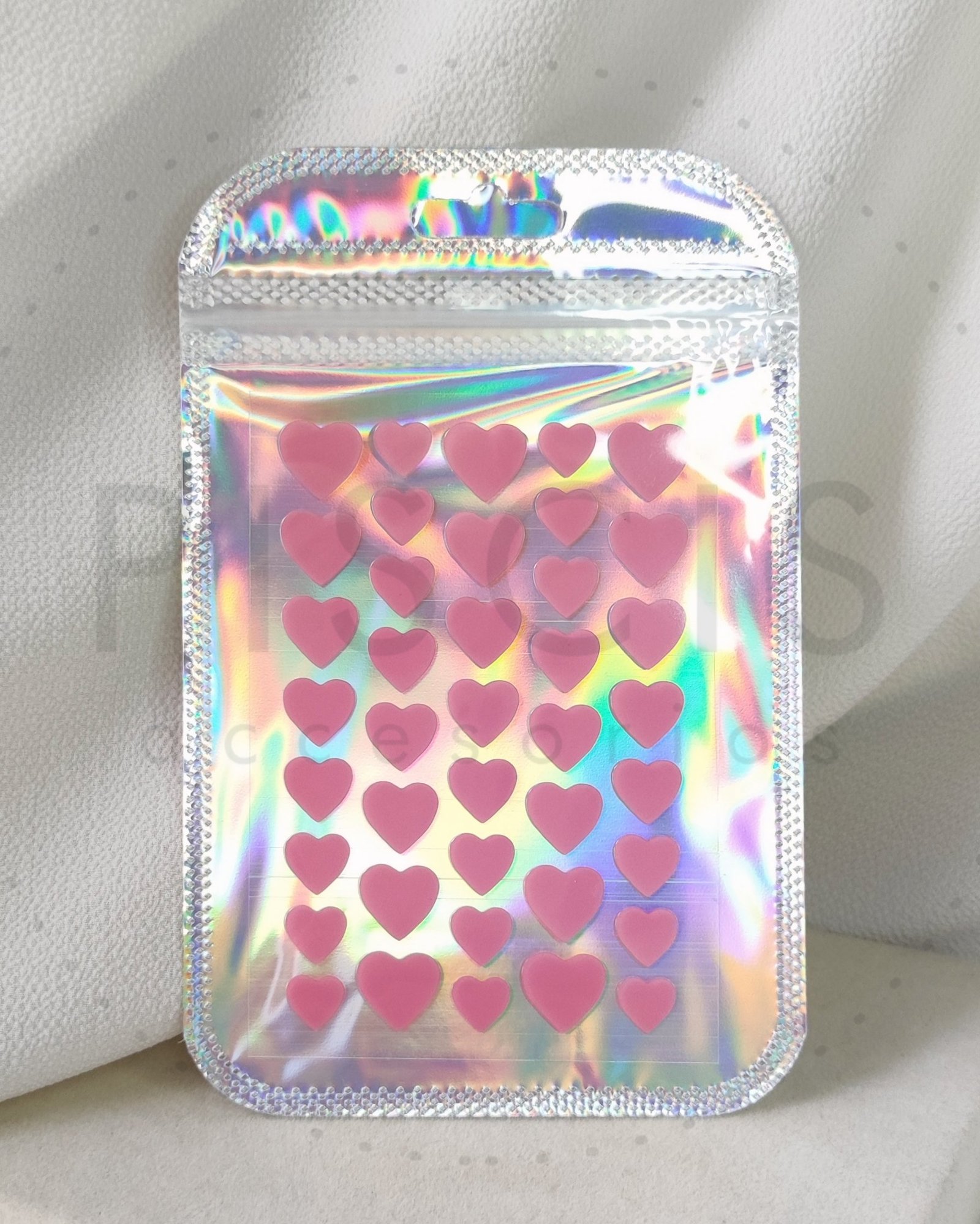 Parches para acné - corazones rosas.
